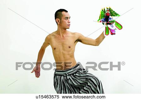 Stock Photography - Bare Chest, Doll, Dancing, Asian Ethnicity. Fotosearch