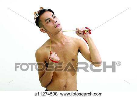 Stock Photo - Bare Chest, Exercise Equipment, Cap, Asian Ethnicity. Fotosearch
