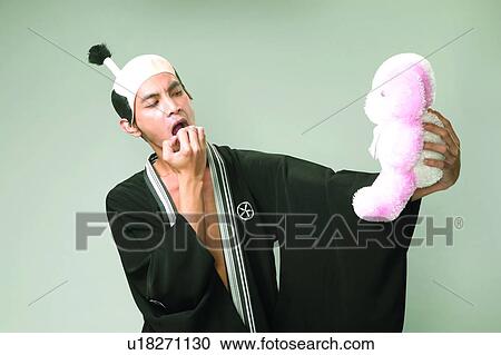 Biting, Eyes Closed, Expressions, Asian Ethnicity View Large Photo Image Stock Image - Biting, Eyes Closed, Expressions, Asian Ethnicity. Fotosearch