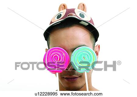 Candy, One Young Man Only, Expressions, Human Face, Food And Drink, Lollipop View Large Photo Image Stock Photography - Candy, One Young Man Only, Expressions, Human Face, Food And Drink, Lollipop. Fotosearch