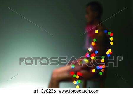 Stock Photography - Christmas Lights, Defocused, Asian Ethnicity. Fotosearch