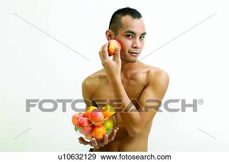 Stock Photo - Expressions, White Background, Food And Drink, Apple, One Person. Fotosearch