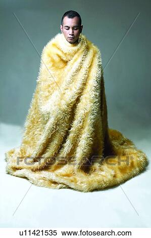 Stock Photography - Fur, Thinking, Young Adult, Sitting, Attitude. Fotosearch