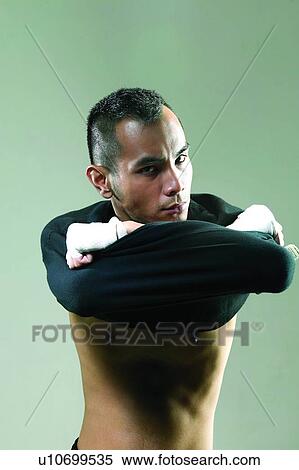 Stock Photography - One Person, Young Adult, Shaved Head, Men Expressions, Indoor. Fotosearch