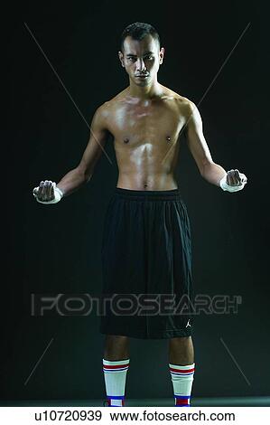 Stock Photo - Sports Glove, Shaved Head, Asian Ethnicity, Receding Hairline, Three-Quarter Length, Leisure Activity. Fotosearch