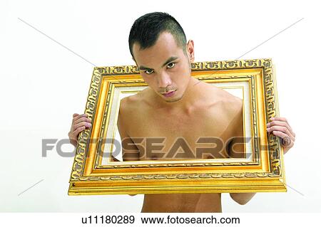 Stock Photo - Waist-Up, Serious, One Young Man Only, Men, Frame, Effort, Individuality. Fotosearch