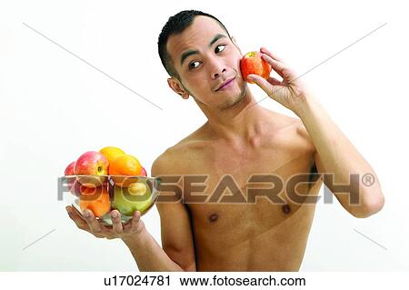 Stock Image - White Background, Fruit, Bowl, Holding, Asian Ethnicity. Fotosearch