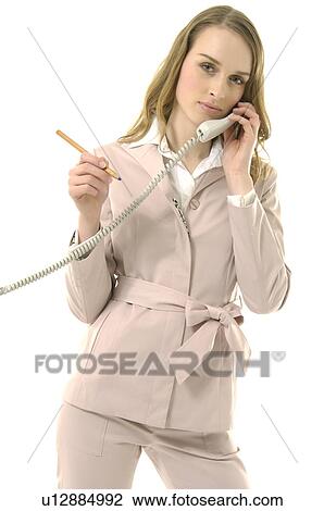 Stock Image - Portrait of a businesswoman talking on the telephone. Fotosearch