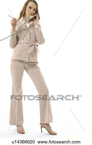 Stock Image - Portrait of a businesswoman talking on the telephone. Fotosearch