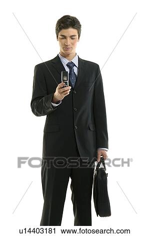 Stock Image - Businessman using a mobile phone. Fotosearch