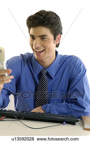 Close-up of a businessman using a mobile phone and laughing View Large Photo Image Stock Photo - Close-up of a businessman using a mobile phone and laughing. Fotosearch