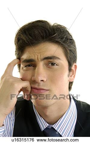 Stock Photograph - Portrait of a businessman thinking. Fotosearch