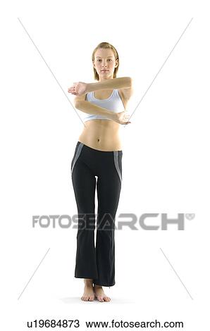 Portrait of a young woman practicing yoga View Large Photo Image Stock Image - Portrait of a young woman practicing yoga. Fotosearch