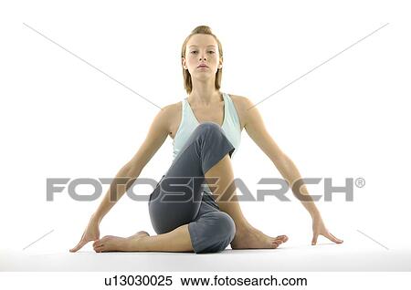 Portrait of a young woman practicing yoga View Large Photo Image Stock Photography - Portrait of a young woman practicing yoga. Fotosearch