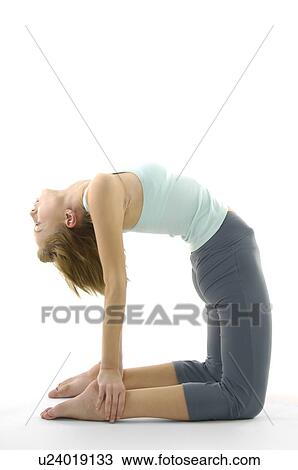 Side profile of a young woman practicing yoga View Large Photo Image Stock Image - Side profile of a young woman practicing yoga. Fotosearch