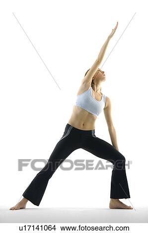 Picture - Young woman practicing yoga. Fotosearch