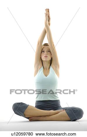 Young woman practicing yoga View Large Photo Image Stock Image - Young woman practicing yoga. Fotosearch