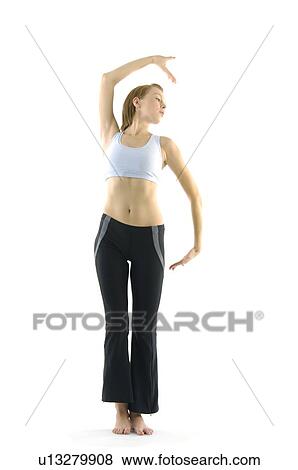 Young woman practicing yoga View Large Photo Image Stock Photo - Young woman practicing yoga. Fotosearch