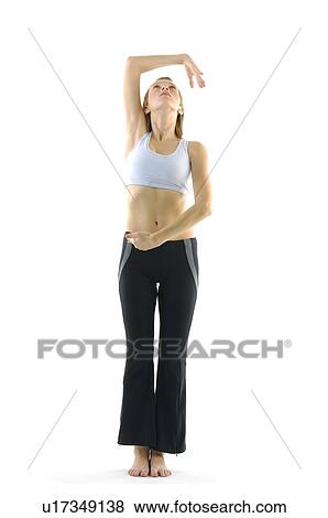 Young woman practicing yoga View Large Photo Image Stock Photo - Young woman practicing yoga. Fotosearch