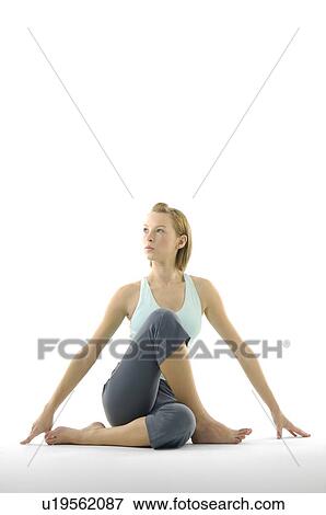 Young woman practicing yoga View Large Photo Image Stock Photo - Young woman practicing yoga. Fotosearch