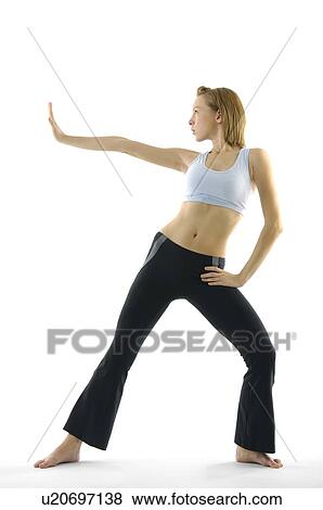 Young woman practicing yoga View Large Photo Image Stock Photo - Young woman practicing yoga. Fotosearch