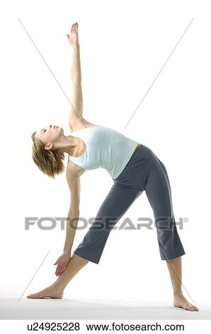 Young woman practicing yoga View Large Photo Image Stock Photo - Young woman practicing yoga. Fotosearch
