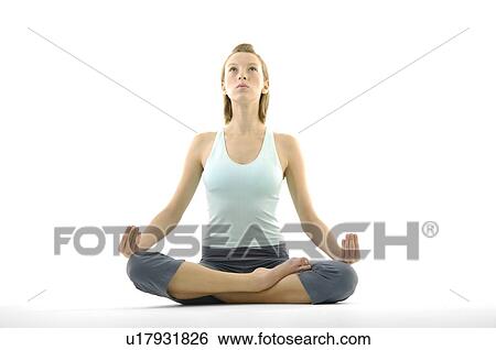 Young woman practicing yoga View Large Photo Image Stock Photograph - Young woman practicing yoga. Fotosearch