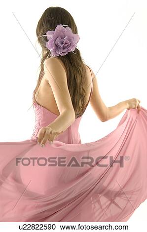 Stock Image - Rear view of a fashion model posing. Fotosearch