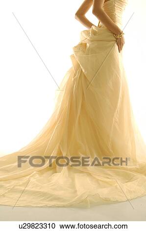 Stock Image - Low section view of a woman standing. Fotosearch