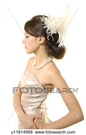 Side profile of a young woman posing View Large Photo Image Stock Photograph - Side profile of a young woman posing. Fotosearch