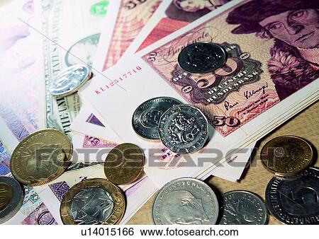 Stock Photograph - cash, money, shadow, light, coin, indoor. Fotosearch