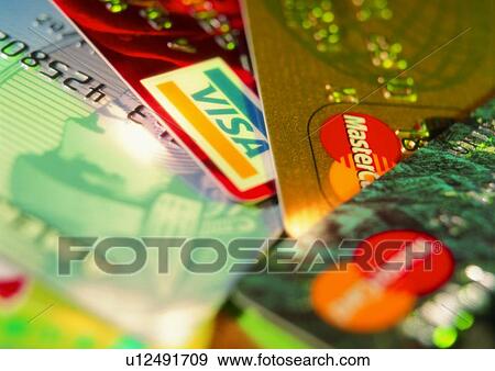 Stock Photo - credit card, money, light, shadow, indoor, cash, business. Fotosearch