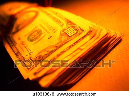 Stock Photo - indoor, cash, money, shadow, light, business. Fotosearch
