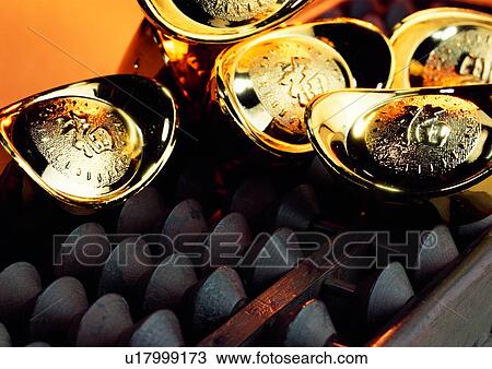 Stock Image - indoor, money, cash, light, shadow, gold. Fotosearch