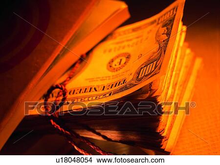 Picture - indoor, money, cash, light, shadow, rope. Fotosearch