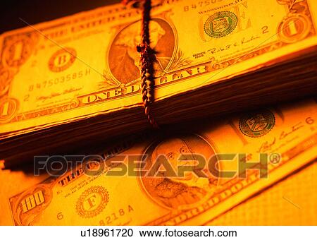Stock Image - indoor, money, cash, light, shadow, rope. Fotosearch