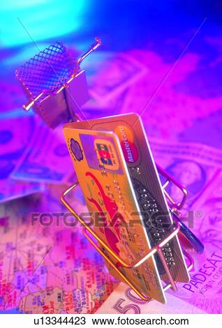 Stock Image - indoor, money, cash, light, shadow, credit card. Fotosearch