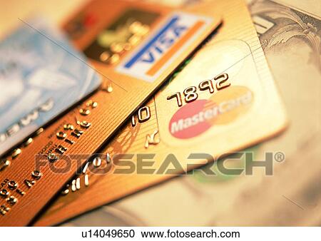 Stock Image - indoor, money, cash, light, shadow, credit card. Fotosearch