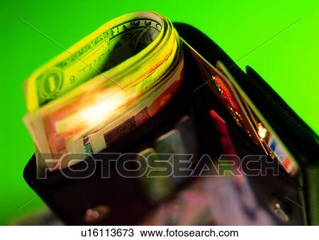 Stock Image - indoor, money, cash, light, shadow, wallet. Fotosearch