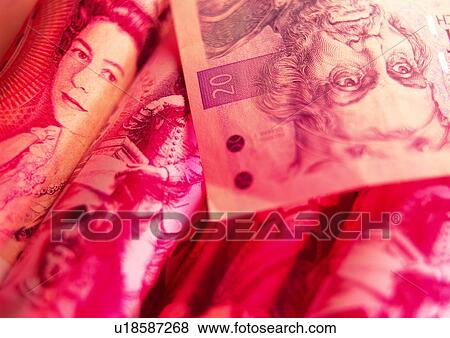 Stock Photo - indoor, money, cash, light, shadow, business. Fotosearch