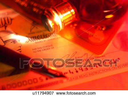 Stock Photo - indoor, money, pen, light, check, credit card, cash. Fotosearch