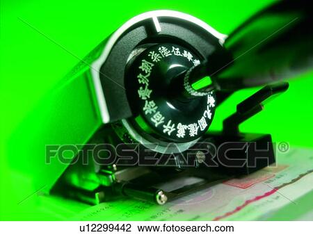 Stock Image - light, machine, shadow, money, cash, check, indoor. Fotosearch