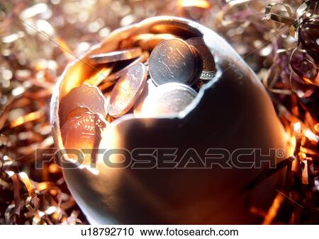 Stock Image - light, shadow, indoor, cash, egg shell, money. Fotosearch