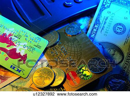 Stock Image - money, commerce, shadow, credit card, light, calculater. Fotosearch