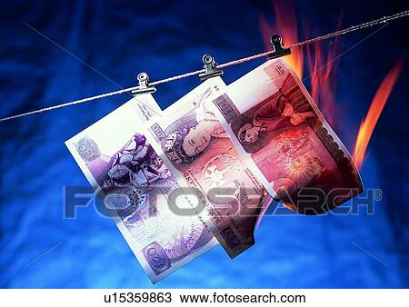 Stock Image - money, fire, cash, light, rope, indoor. Fotosearch