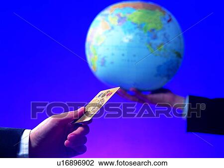 Stock Image - money, indoor, light, commerce, hand, business. Fotosearch
