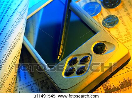Stock Photography - money, shadow, PDA, indoor, coin, pen. Fotosearch