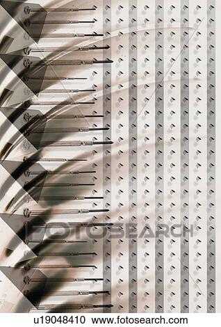 Stock Image - Brown stroked superimposed on a dotted pattern. Fotosearch