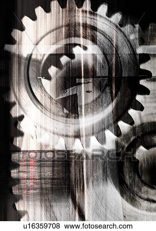 Stock Photo - Gear wheels superimposed on a brown background. Fotosearch