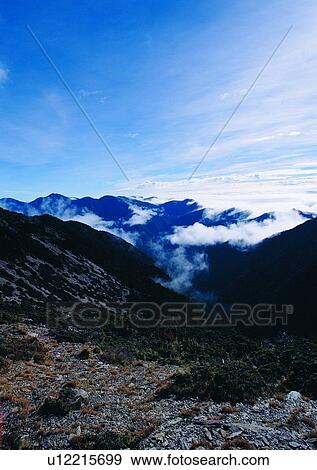 Stock Photo - nature, sky, cloud, mountain, grass. Fotosearch